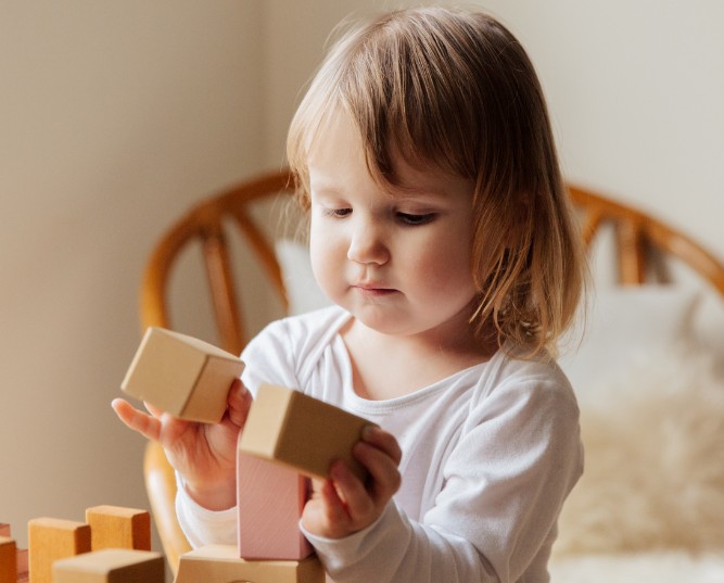Photo Of Child Playing Wooden Blocks Photo Of Child Playing Wooden Blocks