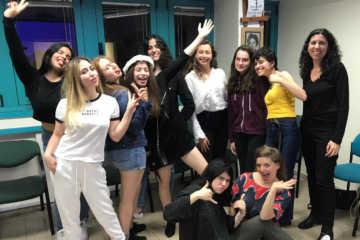 Academia55_360x240_acf_cropped Preschooler Drawing a Picture with Pencils Sitting on Warm Rug with His Brother and Nanny